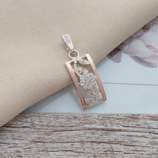 Silver pendant with gold inserts and small white zircons