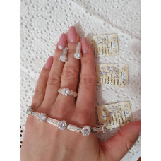 Triple silver set with gold inserts and round white cubic zirconia