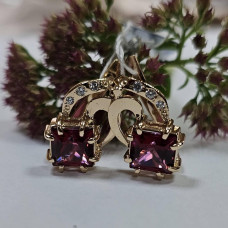 Volumetric gold earrings with natural stones with pink topaz