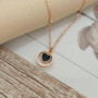 Thin chain gold necklace with heart pendant and black enamel