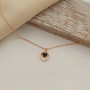 Thin chain gold necklace with heart pendant and black enamel