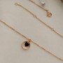 Thin chain gold necklace with heart pendant and black enamel
