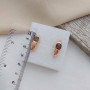 Комплект золотий каблучка та сережки з овальним коричневим раухтопазом 8.41