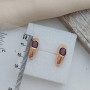 Комплект золотий каблучка та сережки з овальним гранатом 8.65