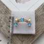 Комплект золотий каблучка та сережки з блакитними круглими топазами 6.59