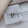 Сережки вкрутки золоті з синьою круглою шпинеллю 1.76