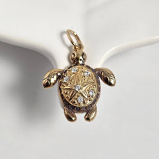 Gilded turtle pendant with an ornament and cubic zirconia