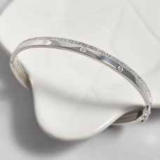 Браслет срібний жорсткий з орнаментом і фіанітами