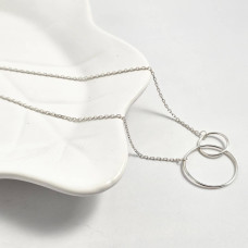Silver necklace chain with round pendants of different sizes