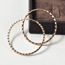 Silver hoop earrings with gold plating and diamond cut
