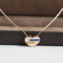 Yellow gold heart necklace with multi-colored enamel inserts, blue and yellow, patriotic