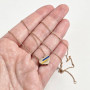 Yellow gold heart necklace with multi-colored enamel inserts, blue and yellow, patriotic