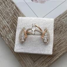 Silver set: ring and earrings with gold soldering and white cubic zirconia of different sizes