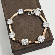 Срібний браслет із золотими вставками та білими круглими фіанітами