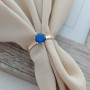 Каблучка срібна із золотими напайками та круглим синім танзанітом
