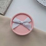 Картонна кругла коробка для каблучки та сережок рожева з сірим і бантиком