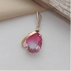 Silver pendant with gold soldering and oval multicolor stone