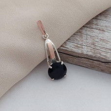 Silver pendant with gold soldering and round black zircon